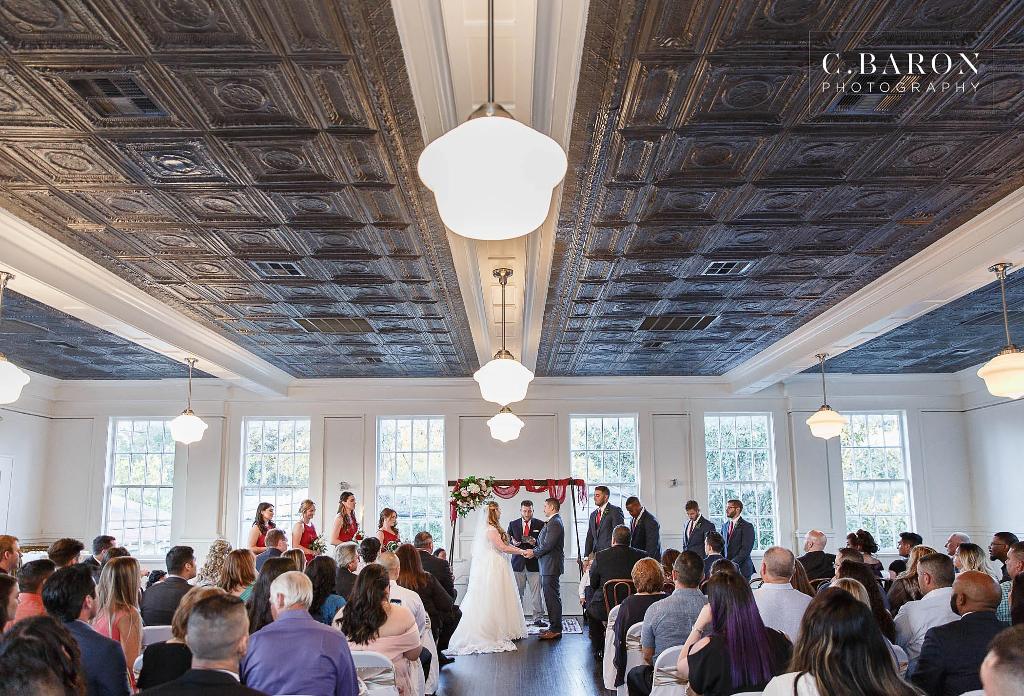 A ceremony on the second floor under the pressed-tin ceiling