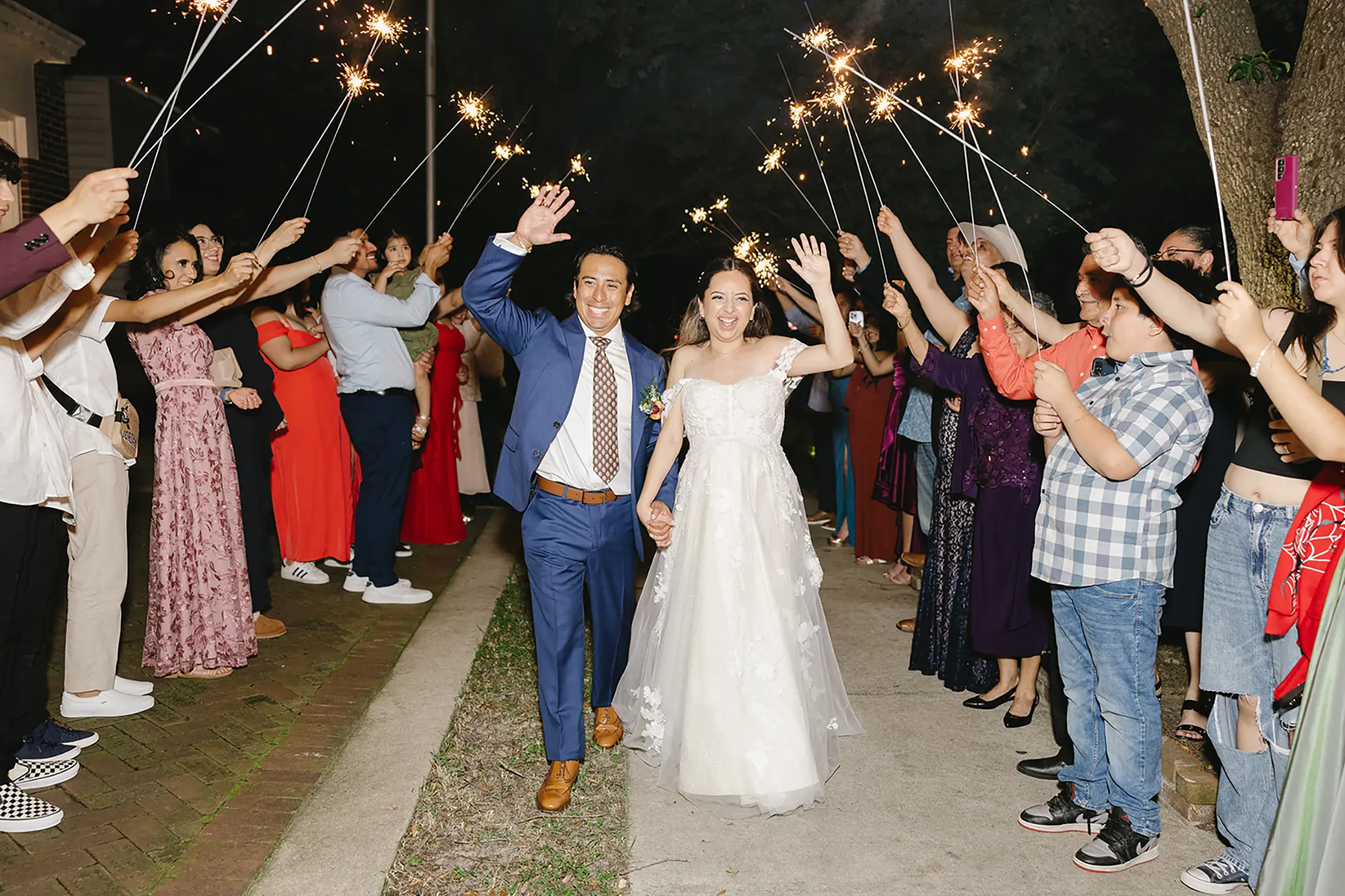 Guests with sparklers at a send-off