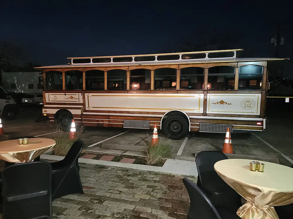 A trolley parked at the station at night